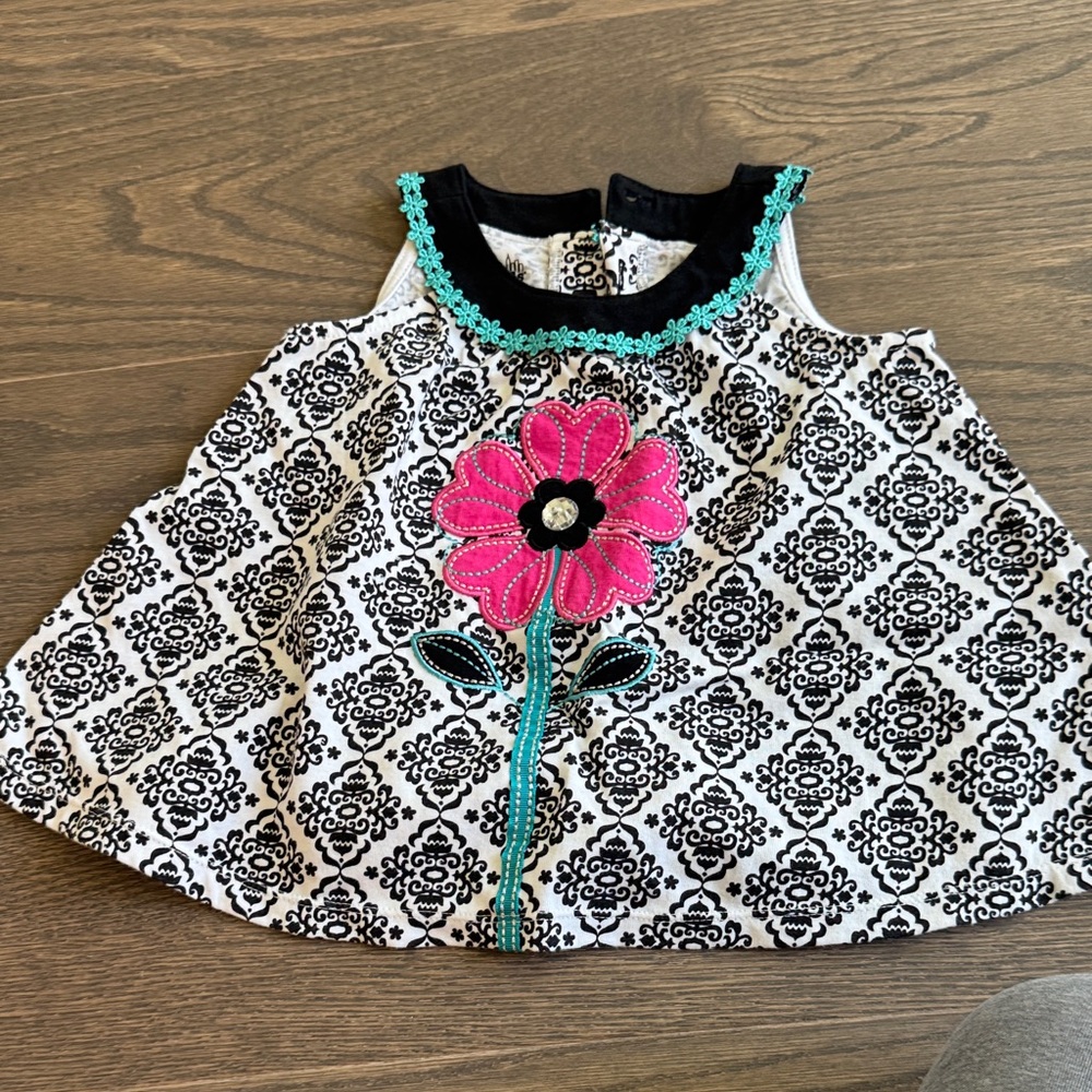 Black & White Patterned Baby Tunic with Pink Flower Appliqué